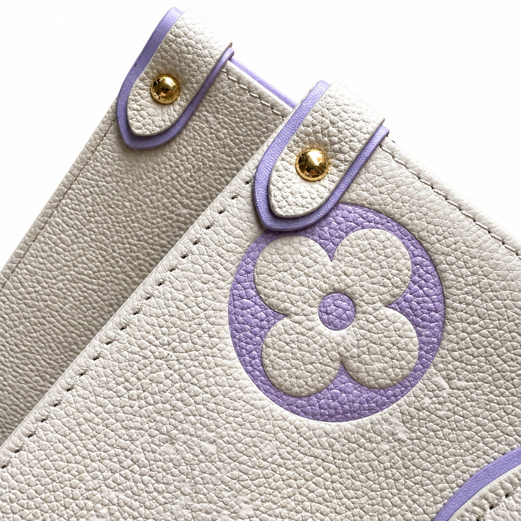 Louis Vuitton OnTheGo MM — Monogram Empreinte Leather in Crème with Lavender Trim & Interior